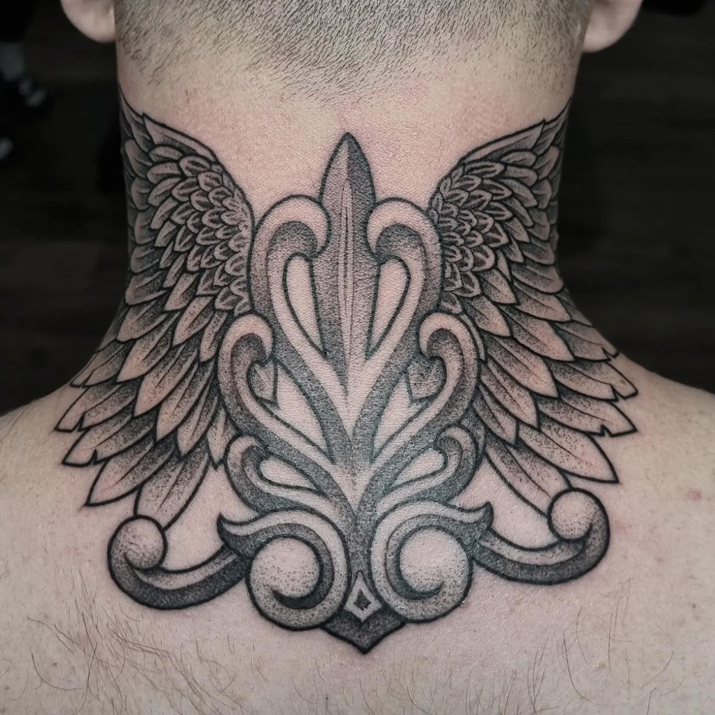 Ornamental filigree wings blackwork neck tattoo by Nicholas Tattoo, Camden NSW