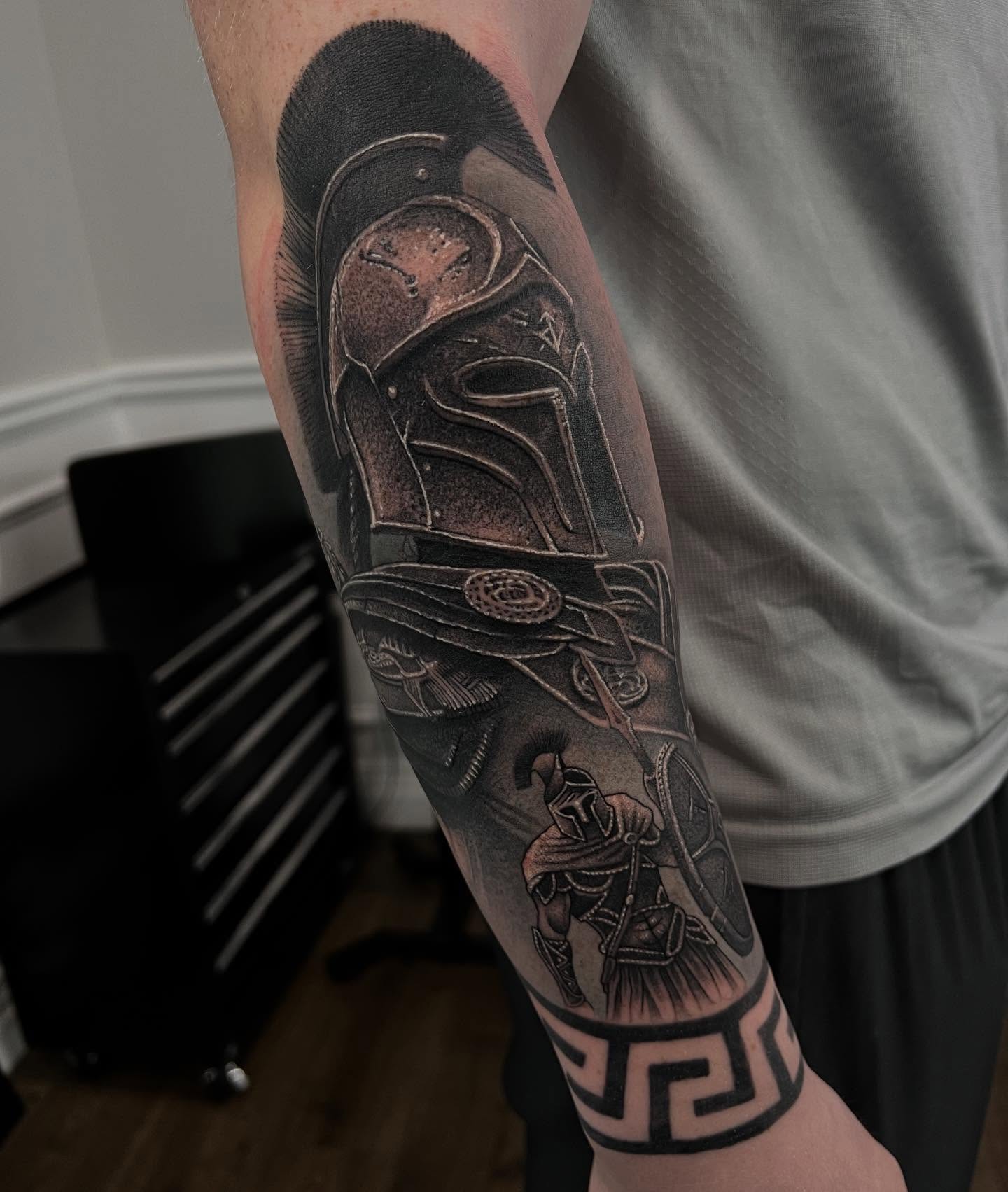 Black and grey realism spartan warrior forearm tattoo by Nicholas Tattoo, Camden NSW