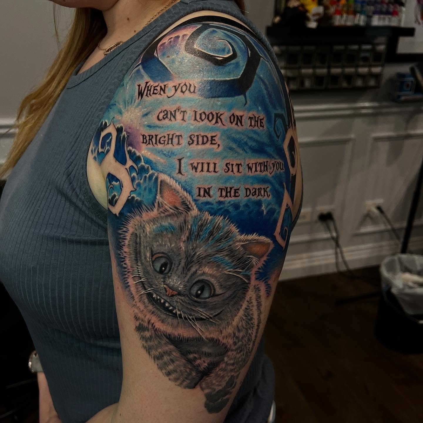 Colour realism Alice in Wonderland Cheshire Cat quote tattoo by Nicholas Tattoo, Camden NSW