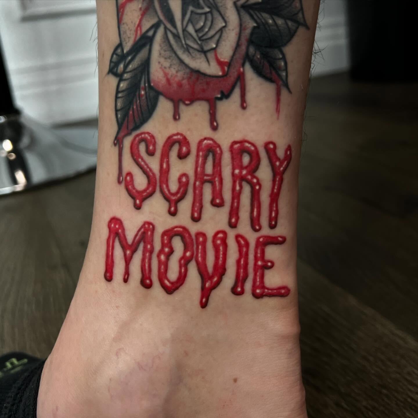 Colour horror Scary Movie blood lettering tattoo by Nicholas Tattoo, Camden NSW