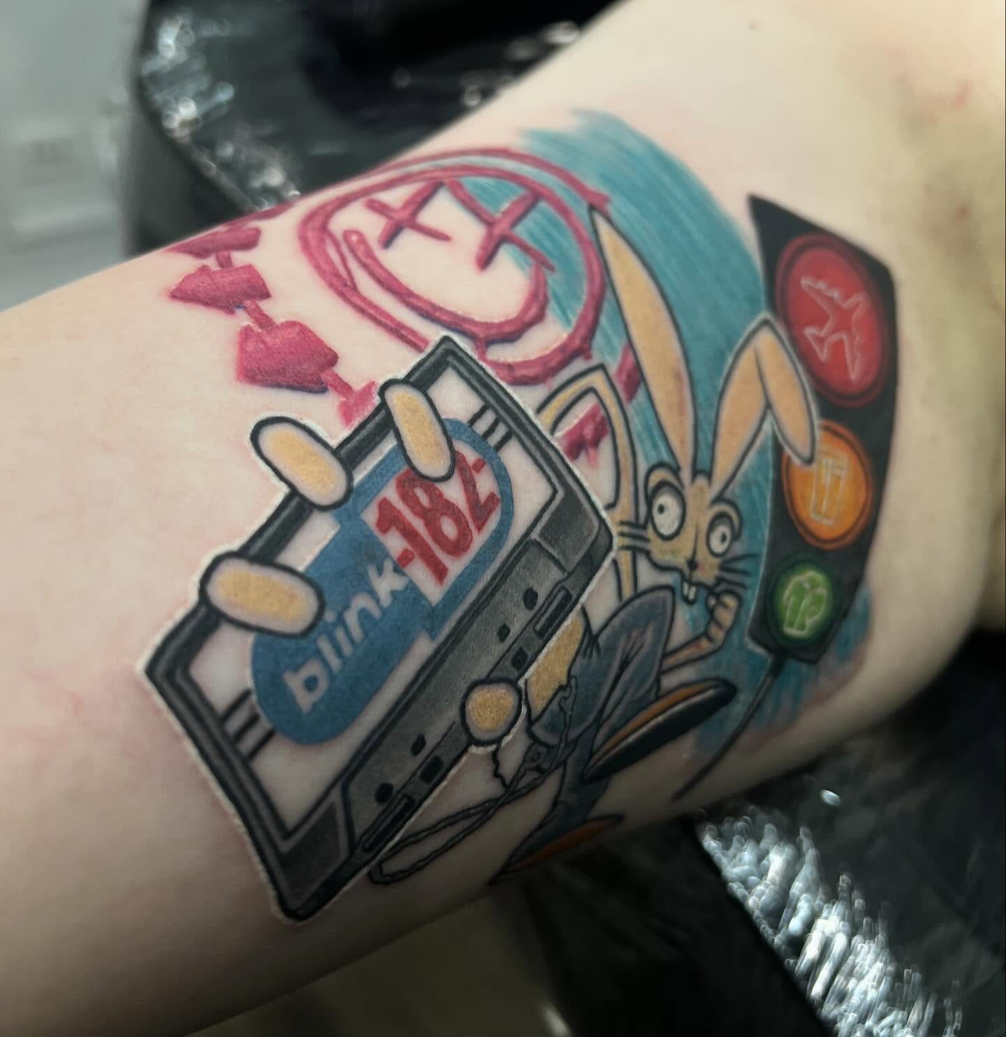 Colour pop punk Blink-182 rabbit and cassette tribute tattoo by Nicholas Tattoo, Camden NSW